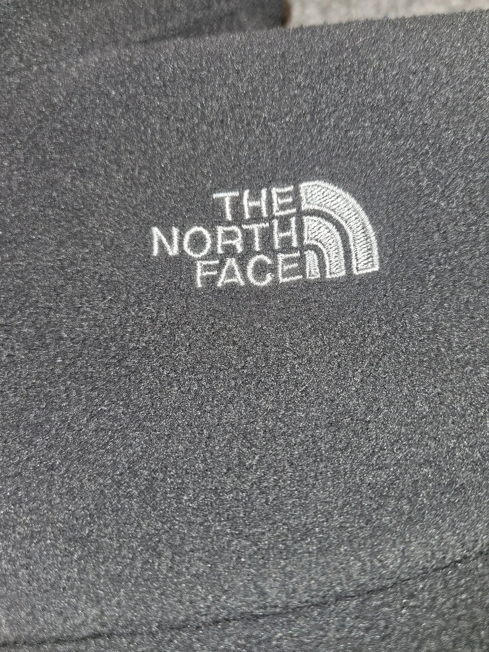 The North Face Kids Dark Gray Fleece Jacket.
